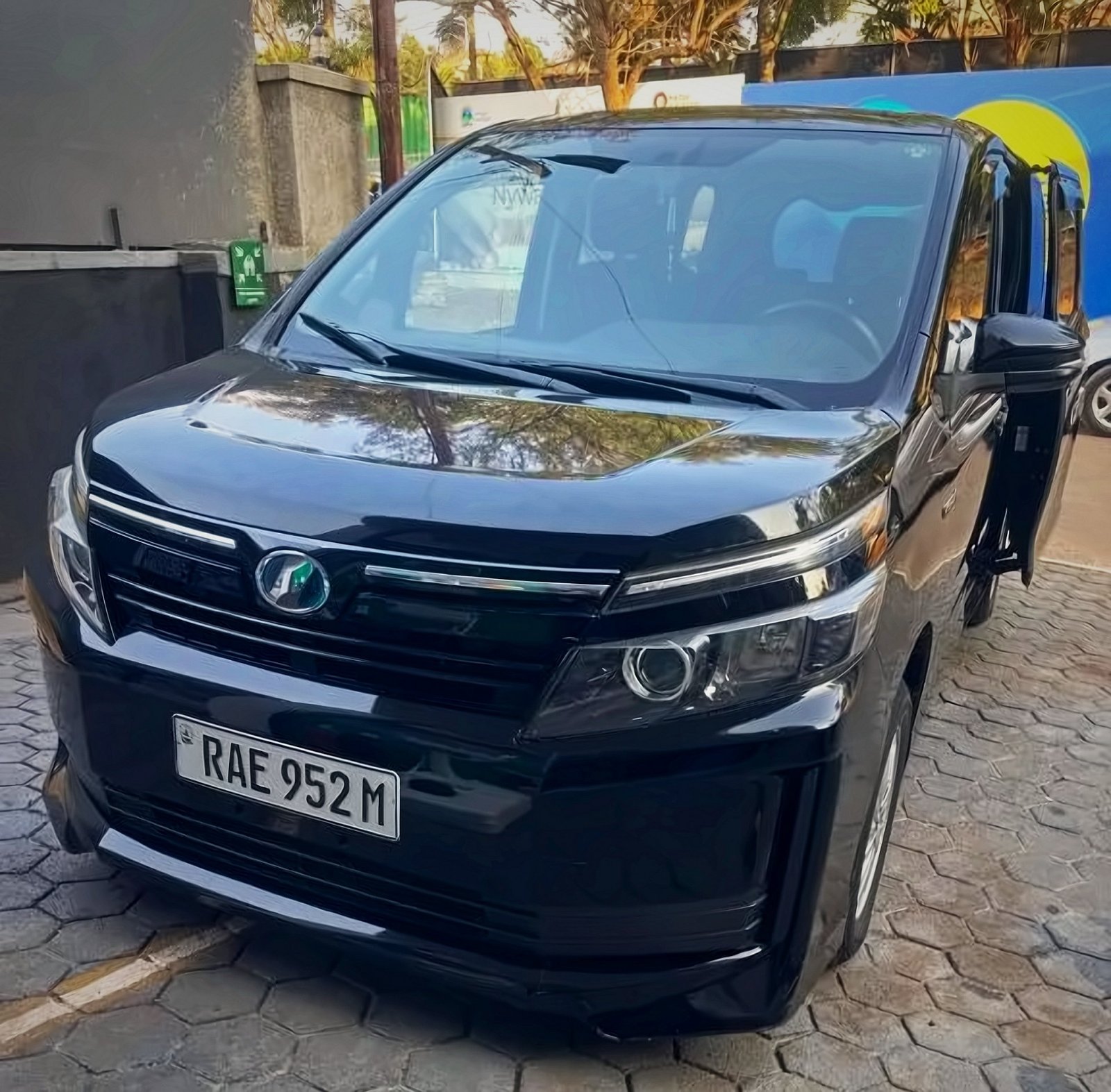 Black minivan used for Holy Apartments airport pickup in Kigali